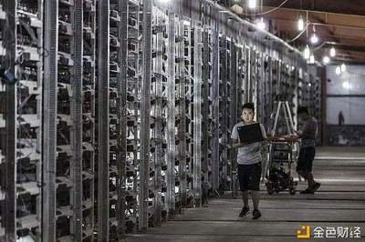 An aerial view of a massive cryptocurrency mining farm, showing rows upon rows of mining rigs.